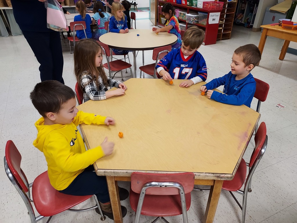 students spinning dreidels