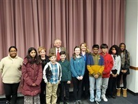 students smiling after earning a writing award