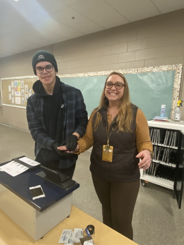 Teacher being fingerprinted by student