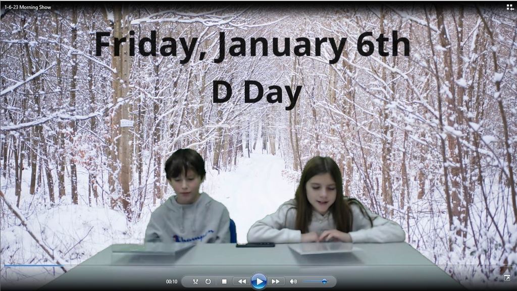 two students at news desk with snowy woods on green screen