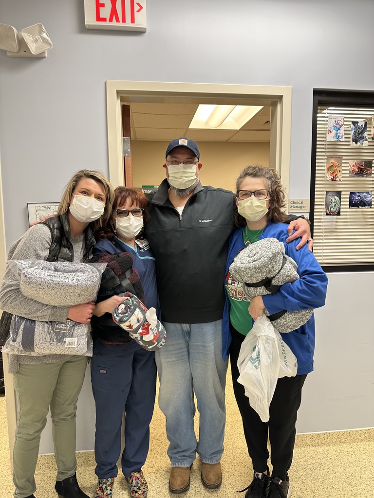 Picture of people with donated blankets