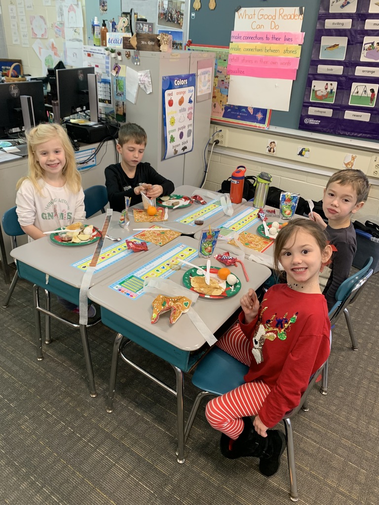 students sitting at desks enjoying breakfast