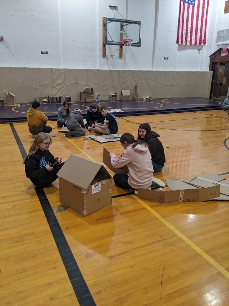 students building with cardboard