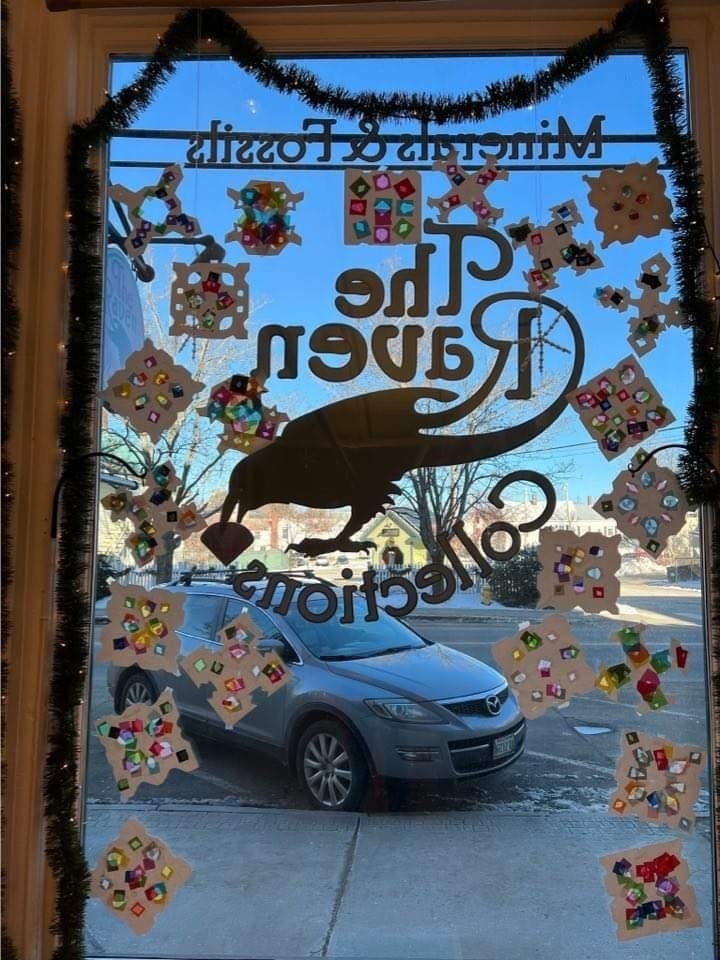 View of the snowflakes in the window at The Raven from inside.