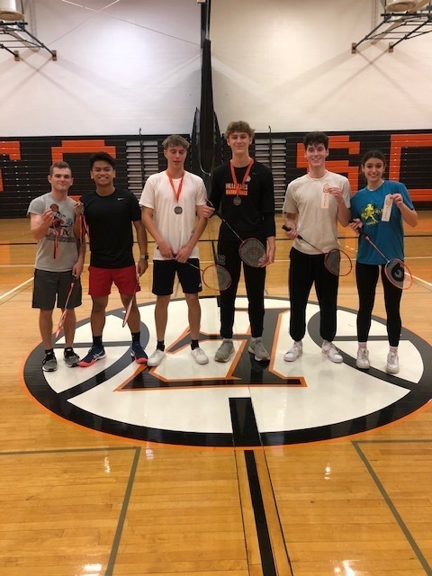 group of six students with badminton raquets