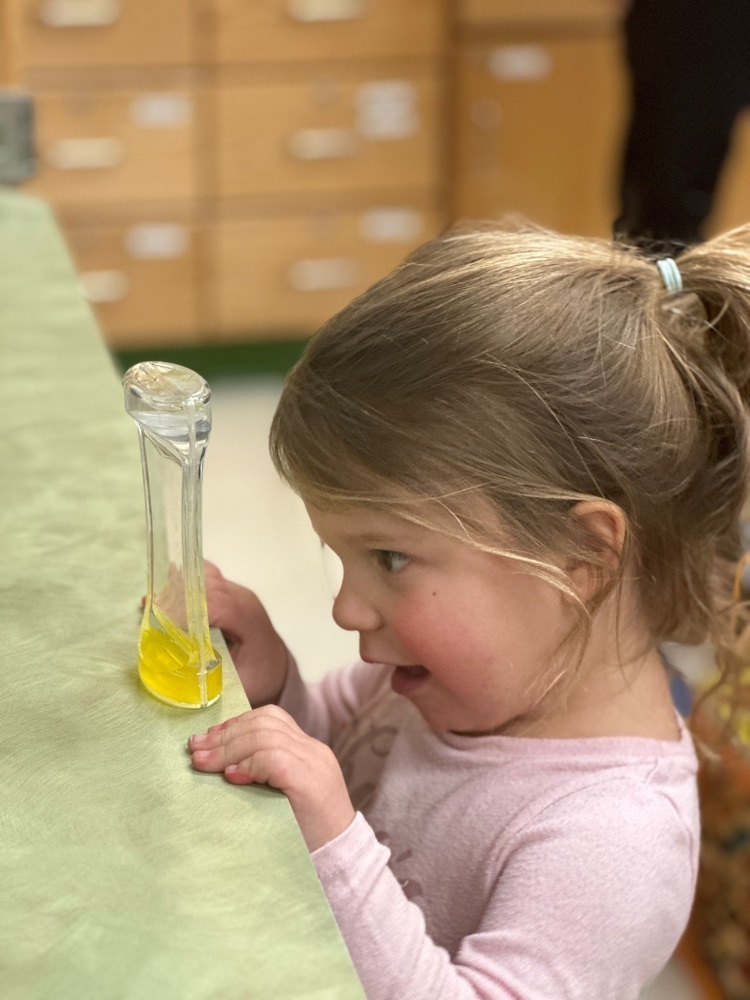 student watching a liquid hour glass