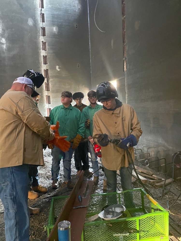 Student practicing welding .