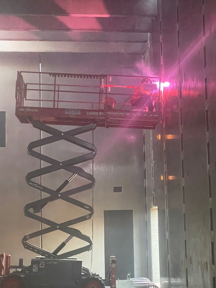 Welder welding in a lift.