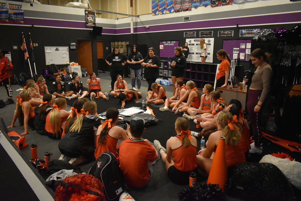 QCHS Cheerleaders meeting after practice