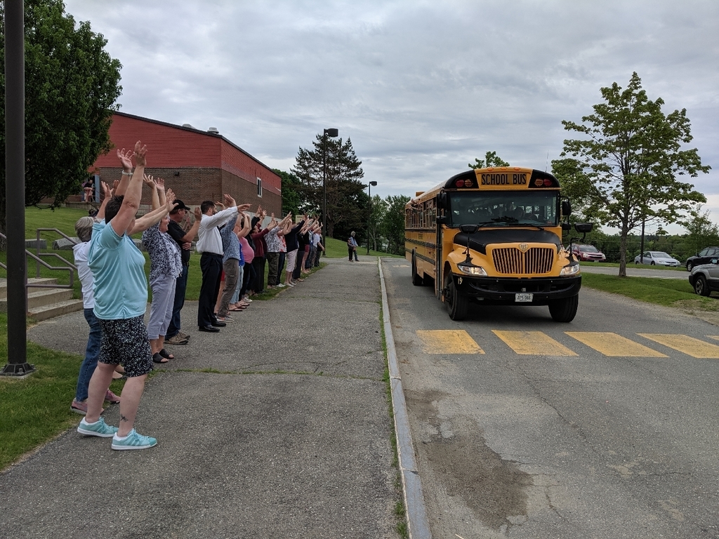 Staff saying goodbye to the students on the last day of school