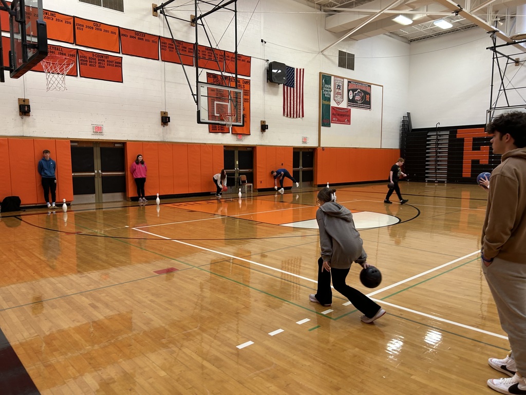 students bowling in the gym