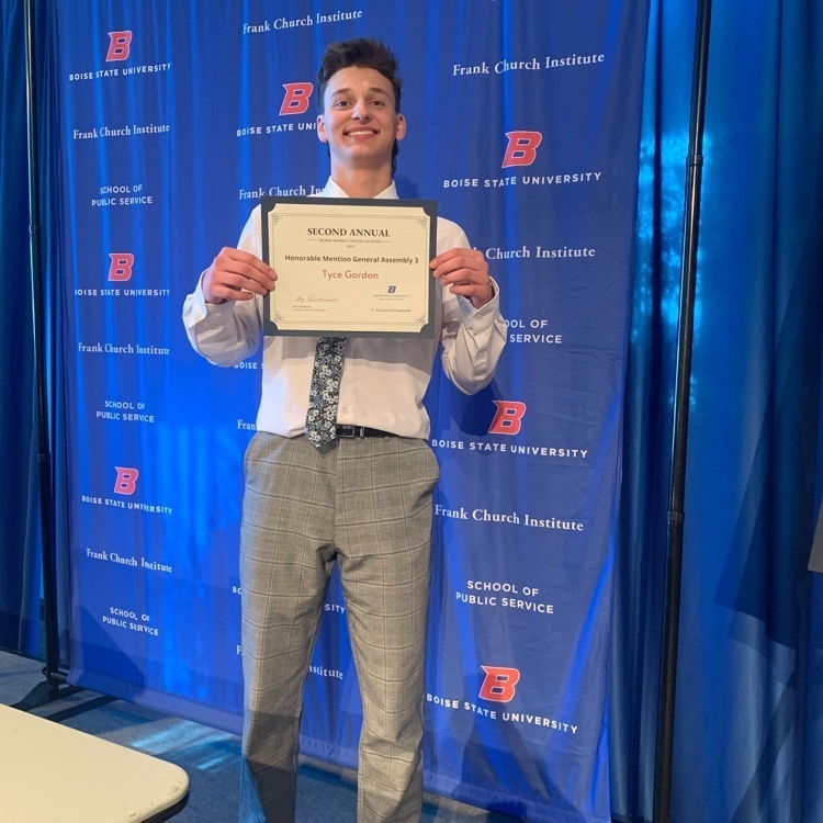 AP government student holding recognition certificate 
