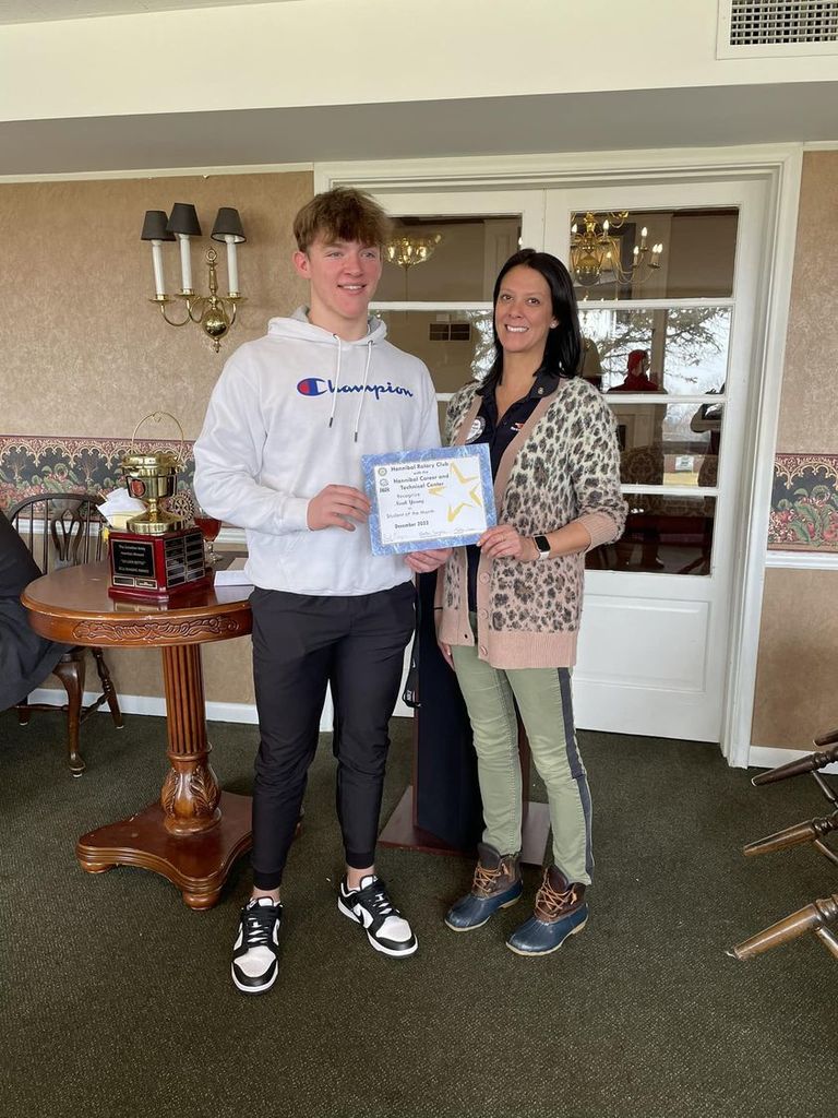 December HCTC Student of the Month Noah Young being honored at The Hannibal Rotary Club. Pictured with club president Heather Temple.