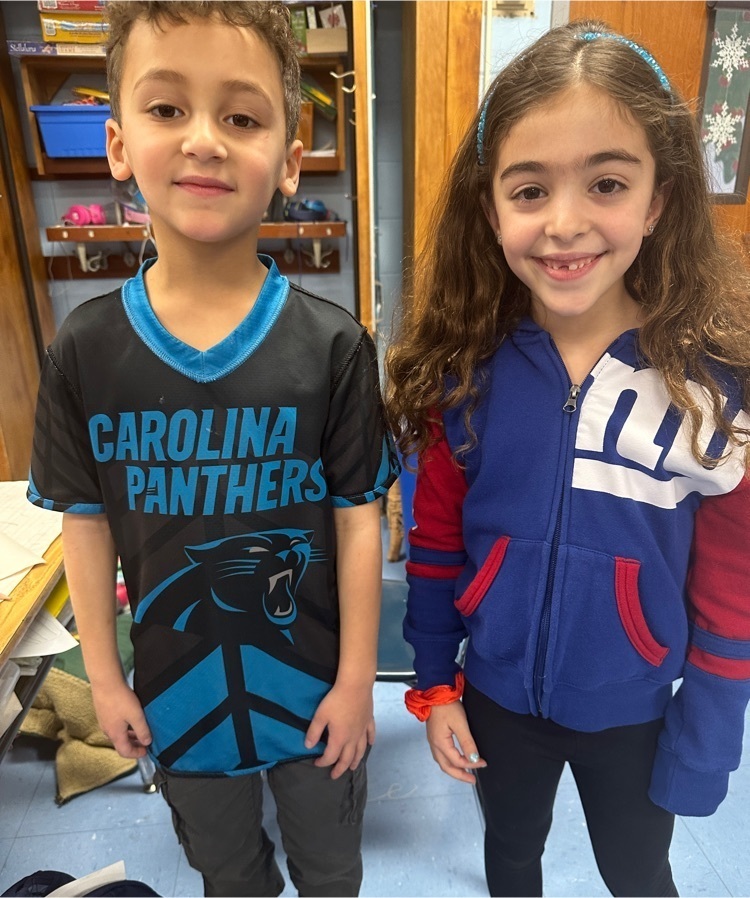 two Wilson students, a boy and a girl, representing “team kindness”