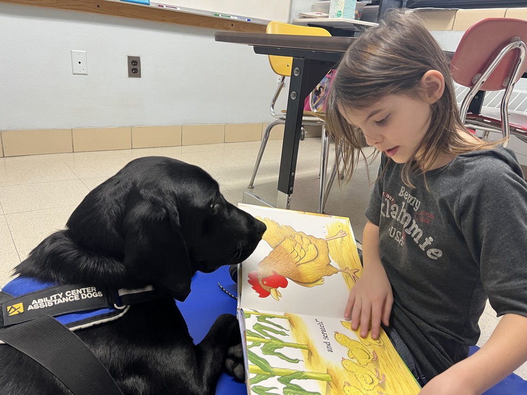 student reading to a dog