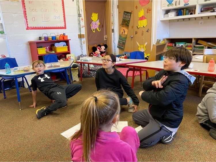 kids practicing ASL