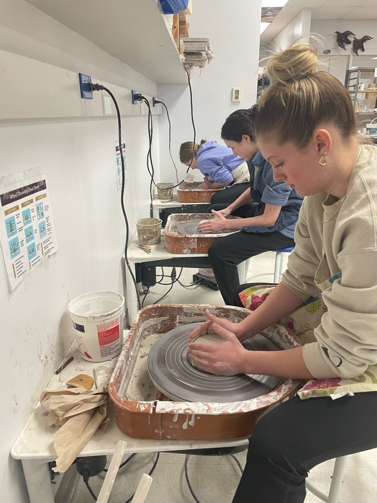 Ceramic 2 students are learning how to throw on the pottery wheel!