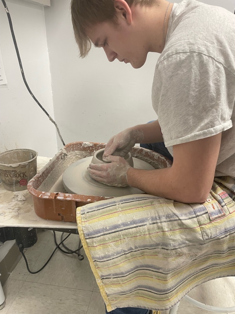 Ceramic 2 students are learning how to throw on the pottery wheel!