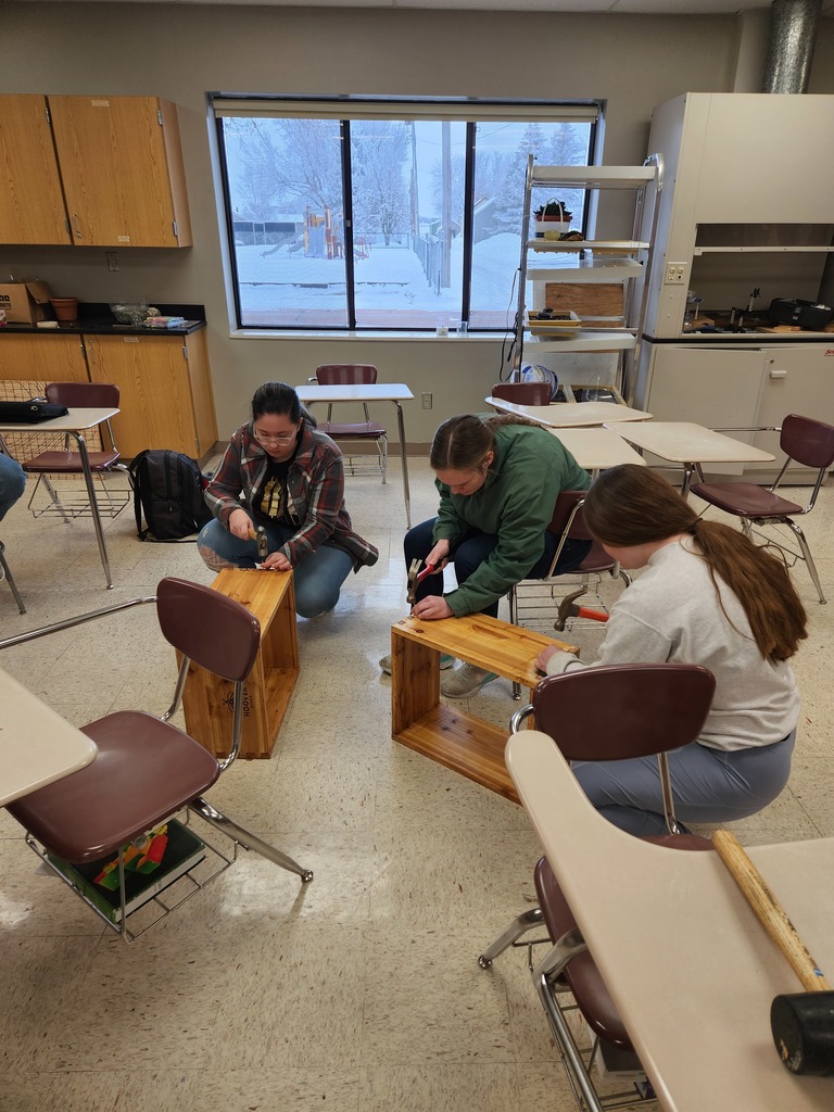 Paige, Kaitlynn, and Lexi nailing the side panels together