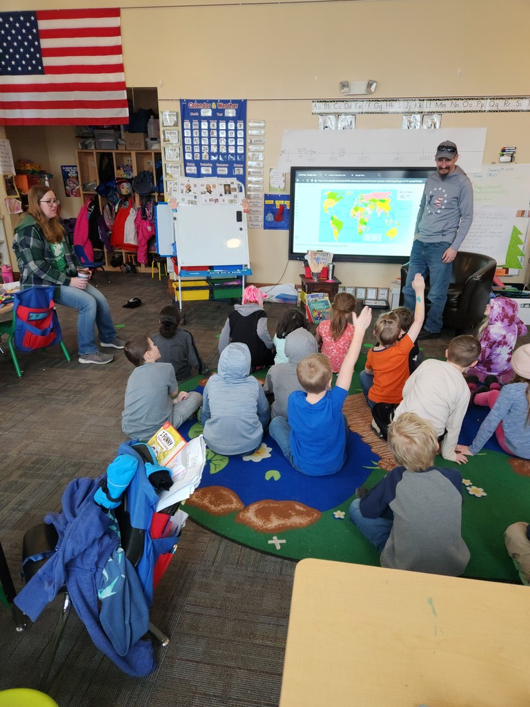 Showing students all the places he was stationed on a map...