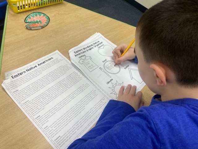 student working on social studies assignment