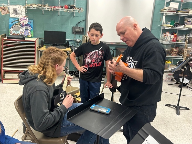 7th & 8th grade band playing the ukulele 