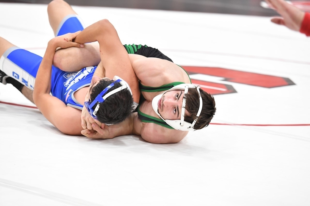 Wrestler wrestling at Strasburg tri