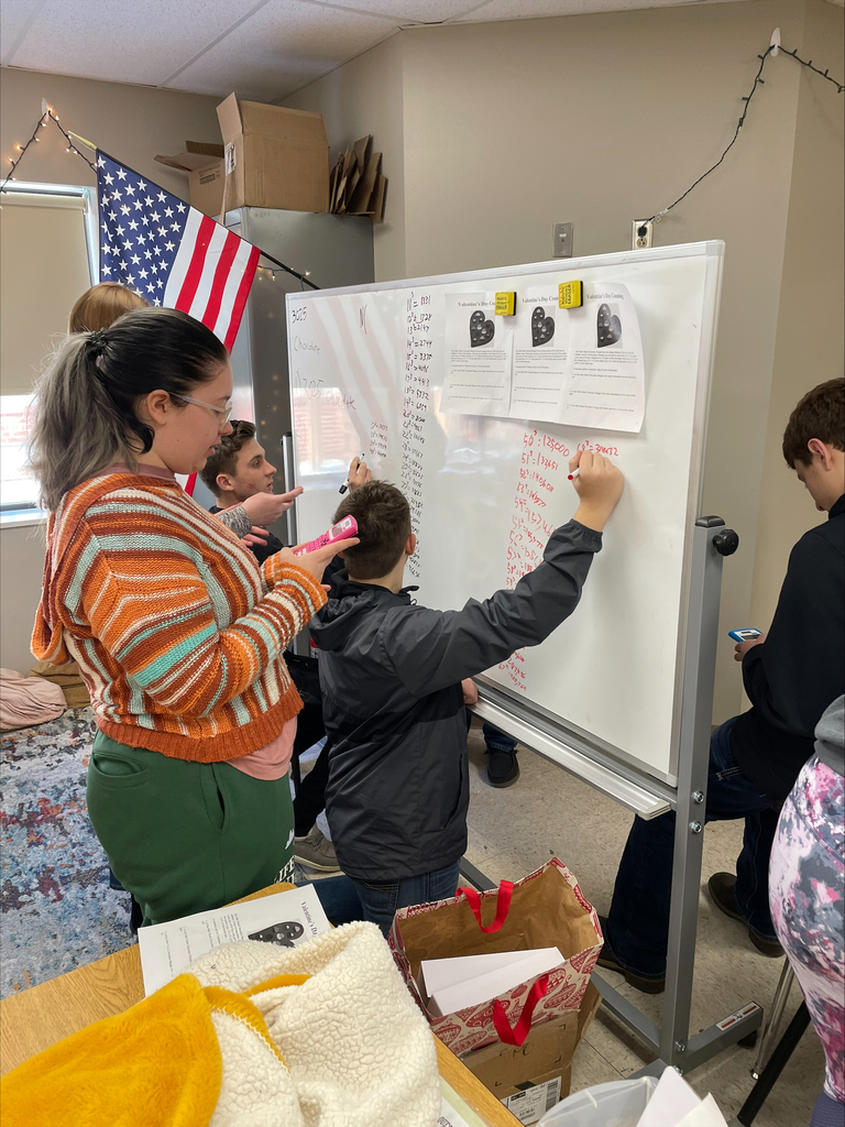 Algebra 2 Students working at a whiteboard