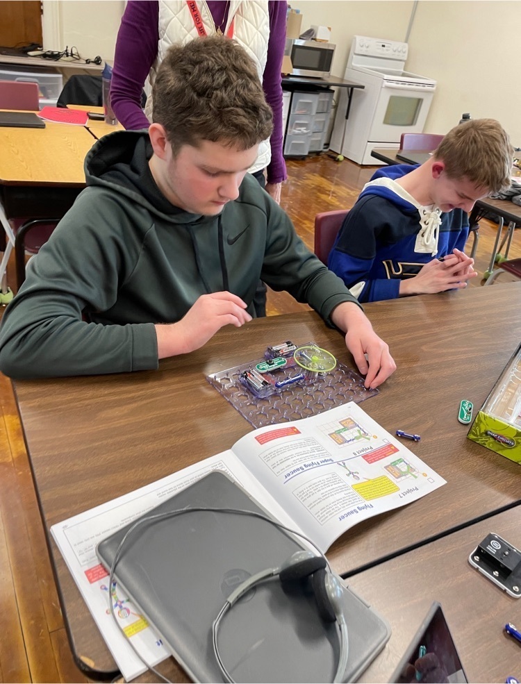 Students building flying saucers