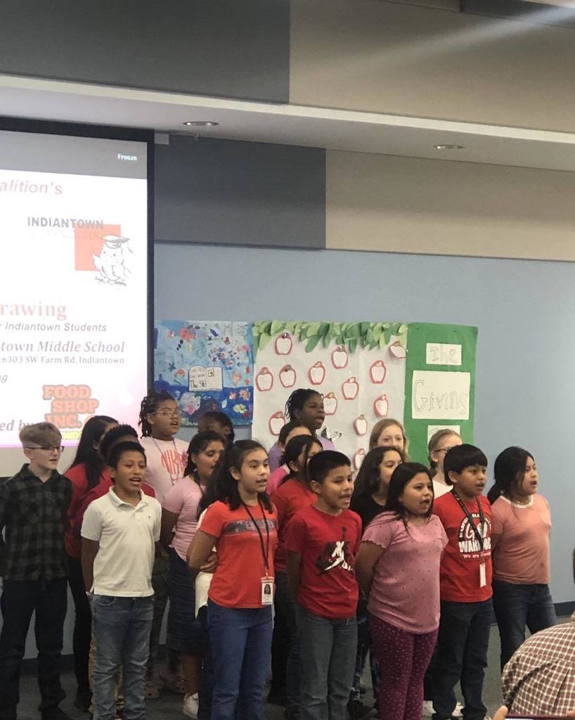 Warfield students sing at IEC luncheon