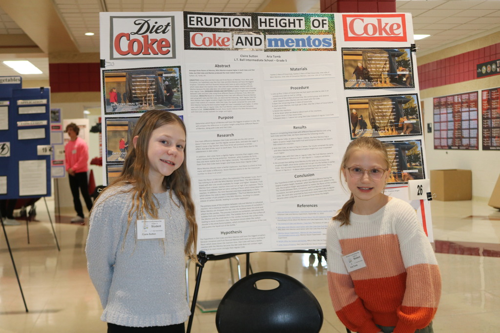 Claire and Aria compete at Science Day.