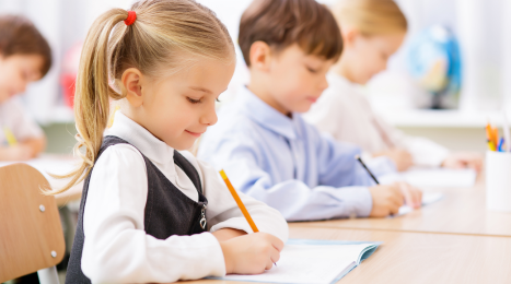 students writing at their desks