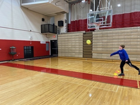 TMS students throws a frisbee