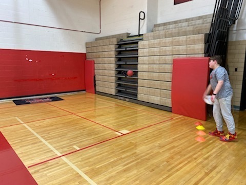 TMS students prepares to toss a frisbee