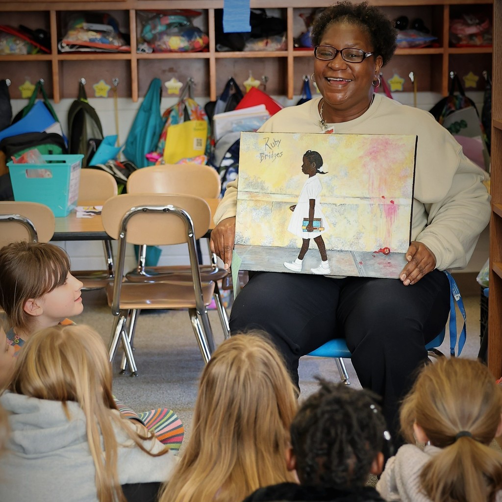 Michelle Zellner with her painting of Ruby Bridges
