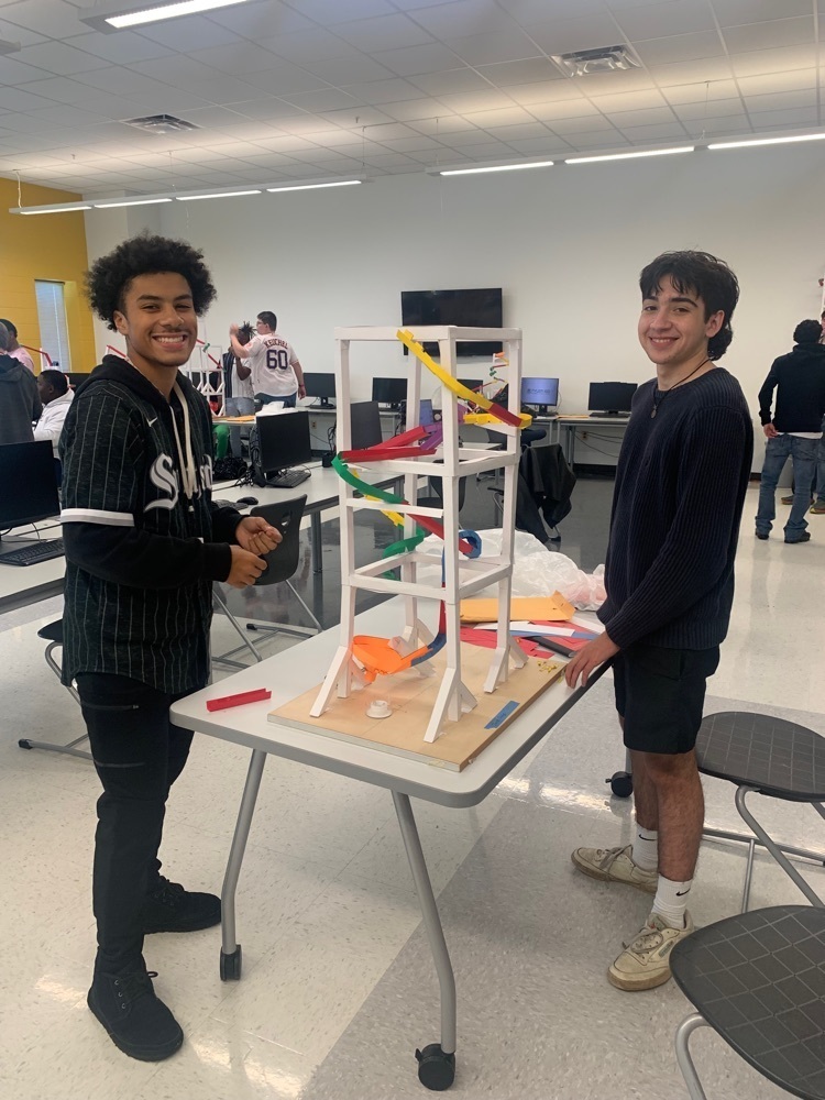 student adjusting roller coaster model