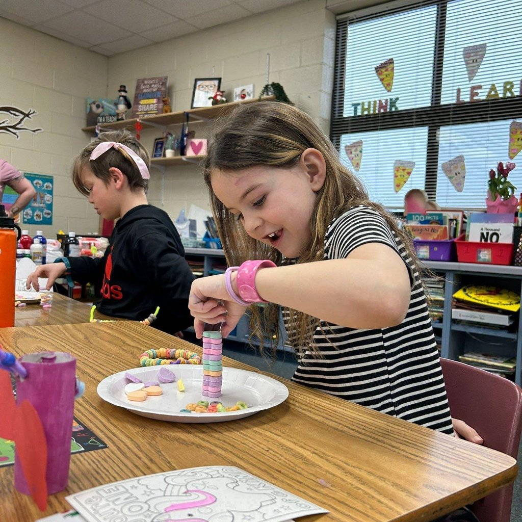 girl plays with conversation hearts
