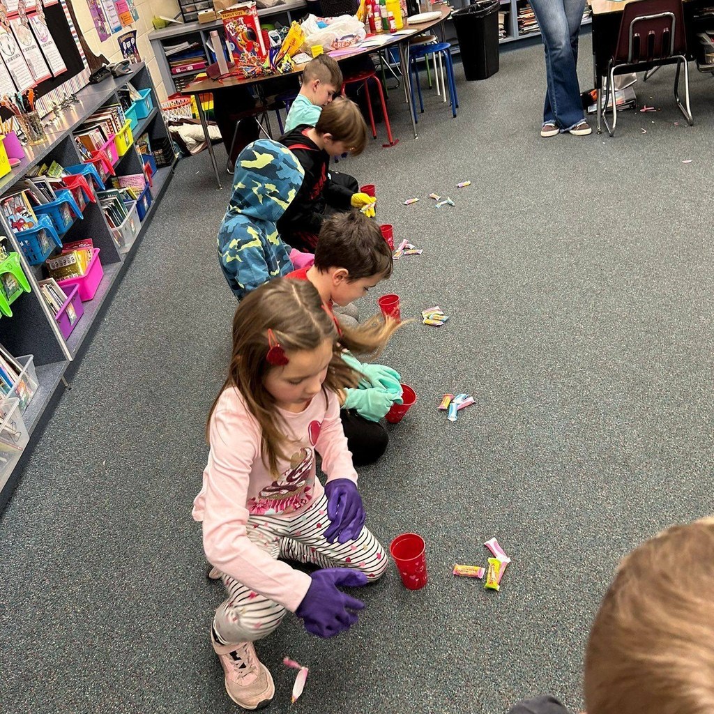 students look at candy together