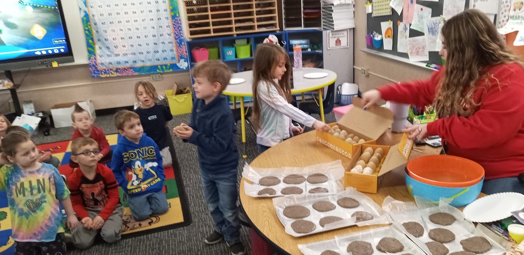 Students work on dinosaur fossils