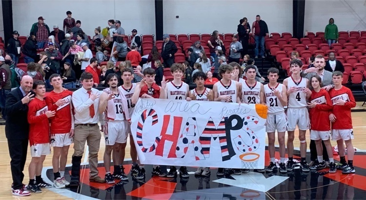 Martinsville Pirates Basketball team holding area win poster 