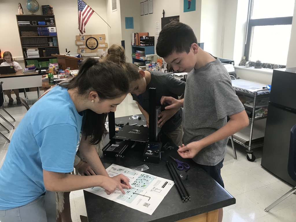 The 8th graders are assembling the 3D printer for the new STEM lab!