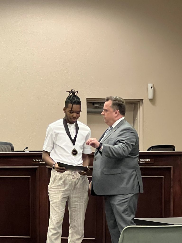 District student of the month, Legacy's Ja'Nayan Manning with Dr. Crawford during the school board meeting