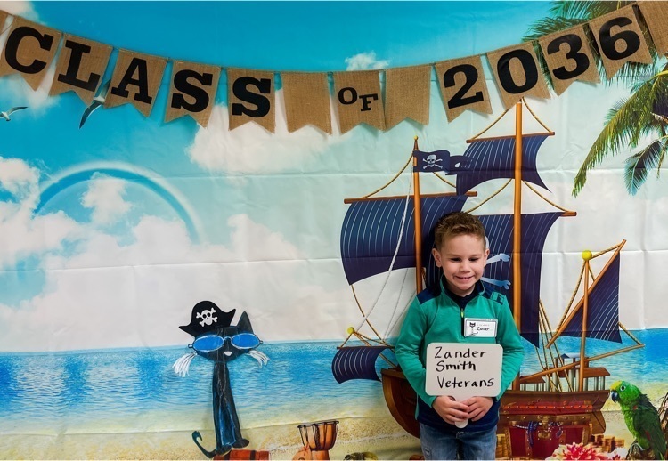student in front of pirate ship photo