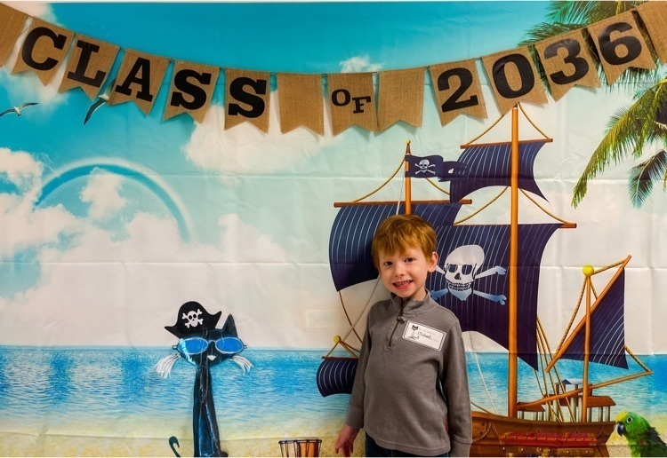 student in front of pirate ship photo 