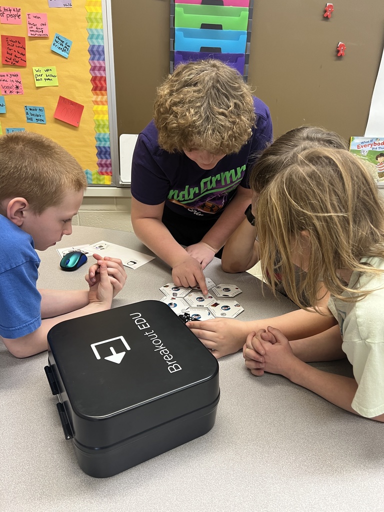 students work in teams to solve the puzzles and unlock the locks on the Breakout boxes