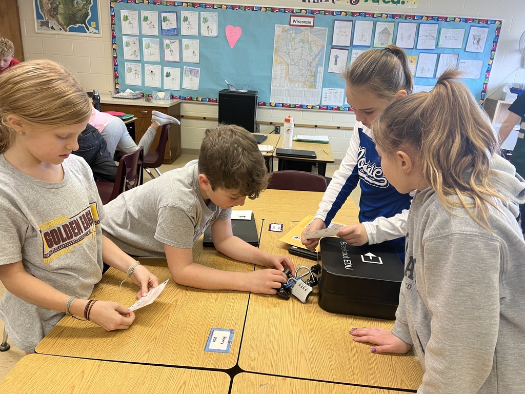students work in teams to solve the puzzles and unlock the locks on the Breakout boxes