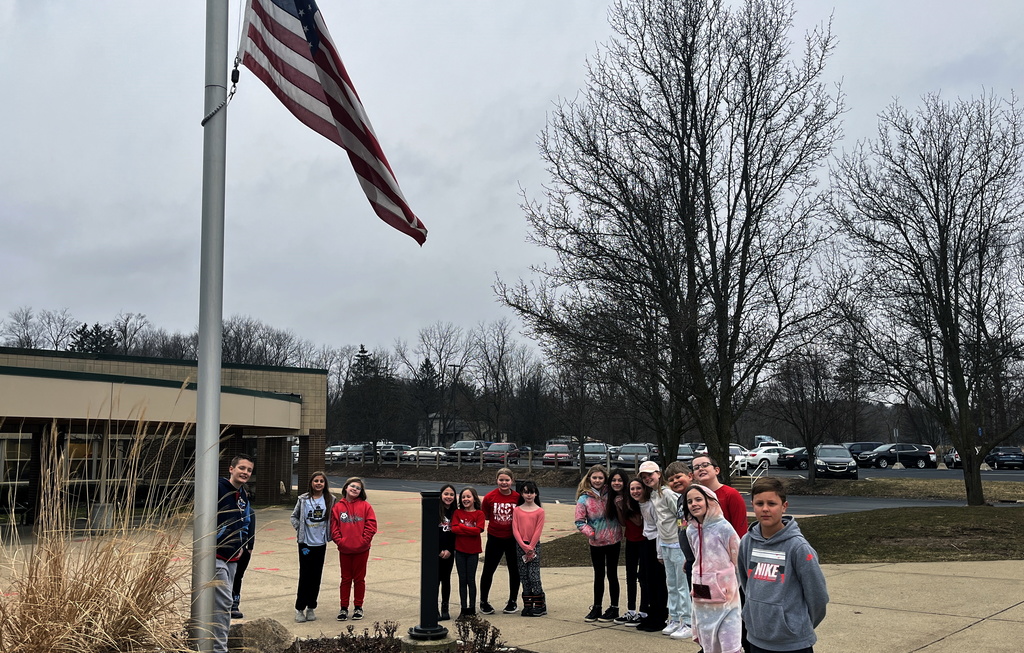 Scouts honor Lt. Quillen and the flag at half staff.