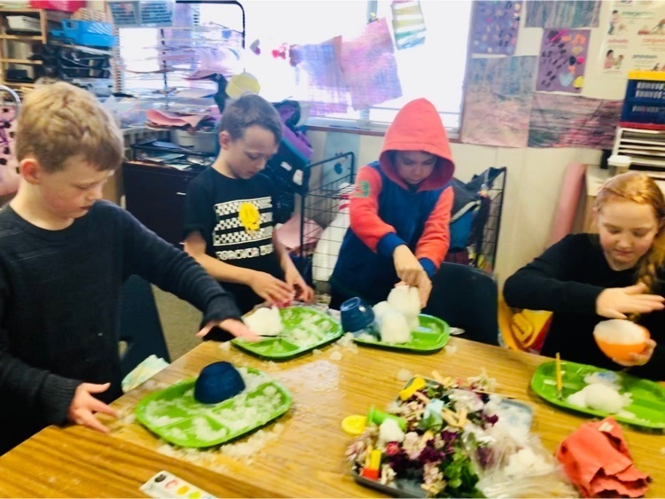 children painting snow