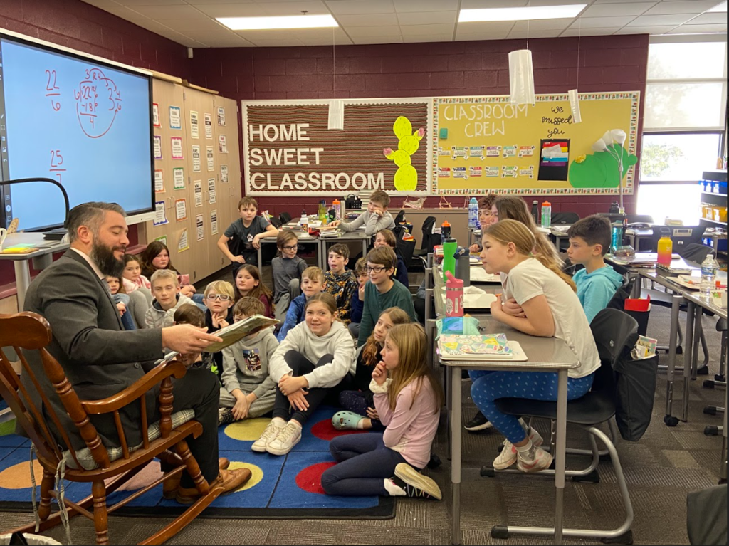 Dr. Salah reading to 4th Graders