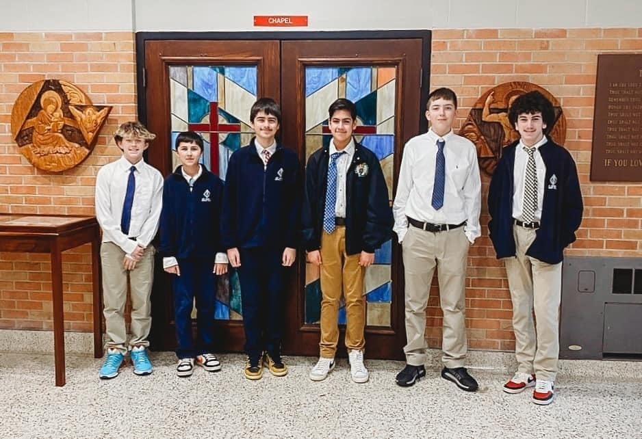 students standing in hallway